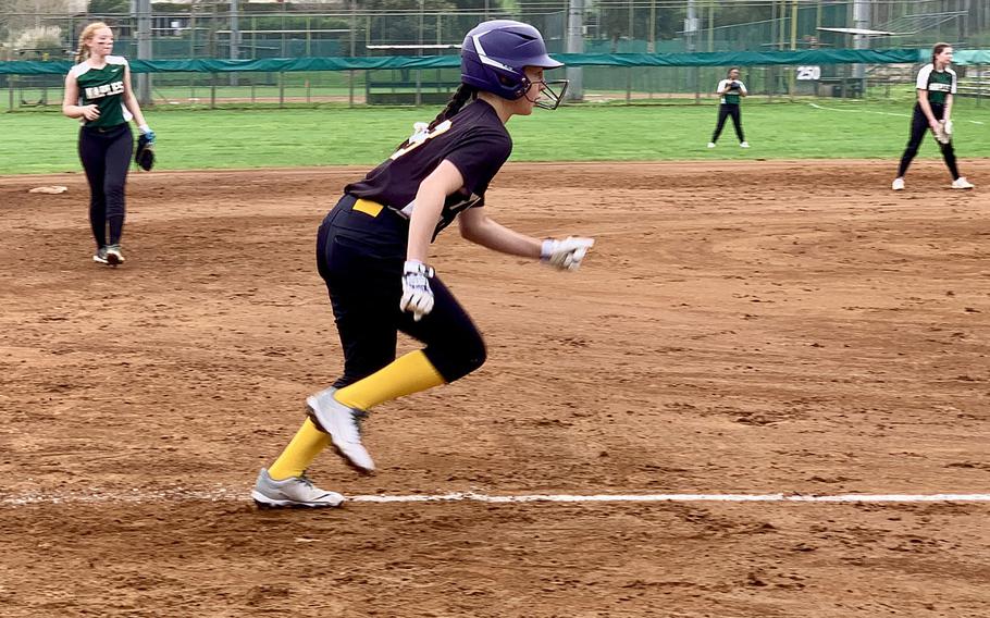 Megan Becker breaks for the plate.