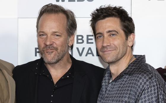 Peter Sarsgaard, left, and Jake Gyllenhaal, shown June 9, say their shared history as in-laws helps them bring out the best in each other on the set of “Presumed Innocent.” Sarsgaard is married to Gyllenhaal’s older sister, actor and director Maggie Gyllenhaal.