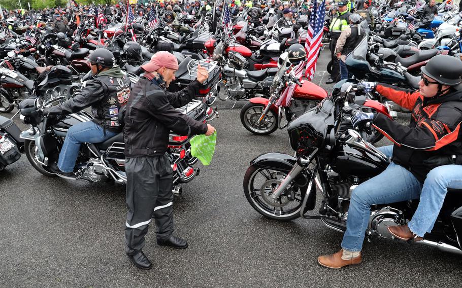 Motorcyclists are guided into place in the RFK Stadium staging area before the Rolling to Remember ride, May 30, 2021 in Washington, D.C..