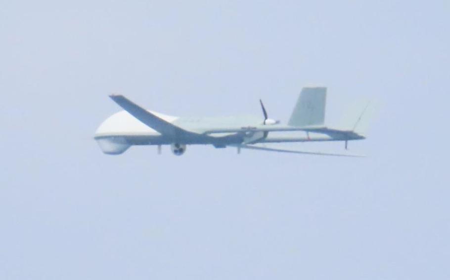 A video still of a military drone operating in open airspace.