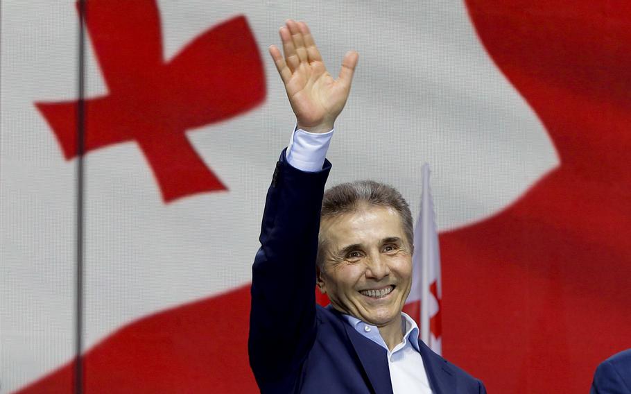 Billionaire Bidzina Ivanishvili, leader the Georgian Dream party, greets demonstrators during a rally in Tbilisi.