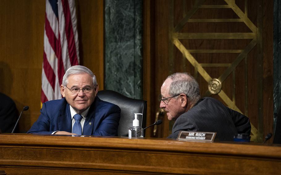 Sen. Bob Menendez, a Democrat from New Jersey and chairman of the Senate Foreign Relations Committee, speaks with Sen. Jim Risch, a Republican from Idaho and ranking member of the Senate Foreign Relations Committee, during a hearing in Washington, DC, on April 26, 2022. 