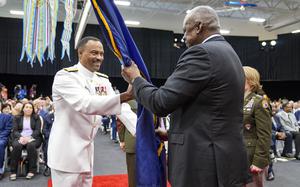 Navy Adm. Alvin Holsey takes the command guidon from Secretary of Defense Lloyd J. Austin during a change-of-command ceremony for SOUTHCOM in Doral, Fla., Nov. 7, 2024