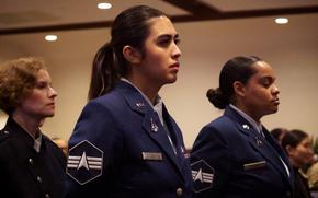 Space Force guardians in dress uniforms stand at attention during an activation ceremony.