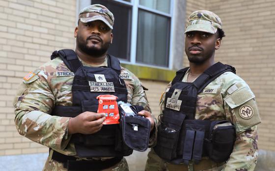 New York Army National Guard Staff Sgt. Joel Strickland, left, and Spec. Desany Jacques, members of the New York National Guard security force in New York City, used their training and issued first aid packages to help save the life of a stabbing victim on May 20, 2024 while on duty in Queens, New York. 