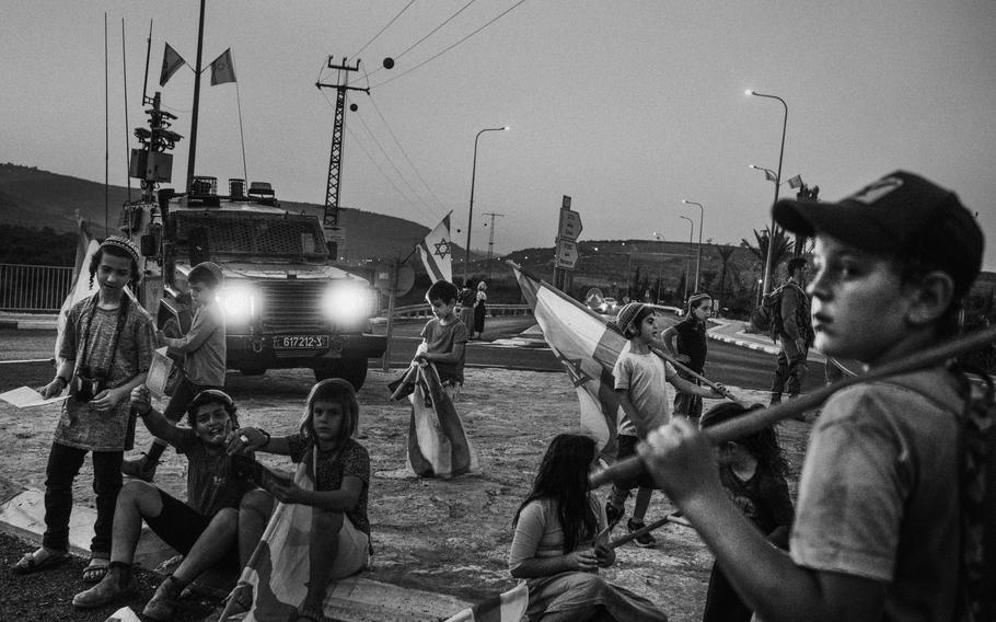 Settlers stage a sit-in Nov. 8, 2023, at the main intersection in front of the Shave Shomron settlement in the West Bank. 