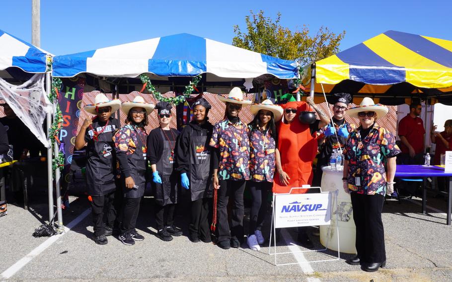 A group photo of competitors participating in the chili cook-off challenge