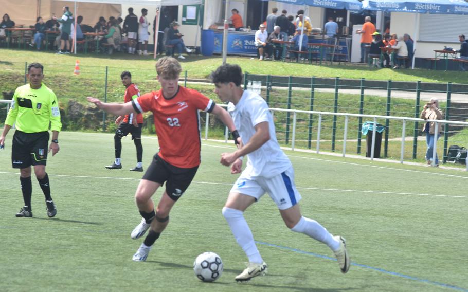 American Overseas School of Rome's Riley Smith and Marymount's Giovanni Folio, who each scored a goal, battle at the DODEA European Division II boys soccer championships Wednesday, May 22, 2024, at Reichenbach-Steegen, Germany.