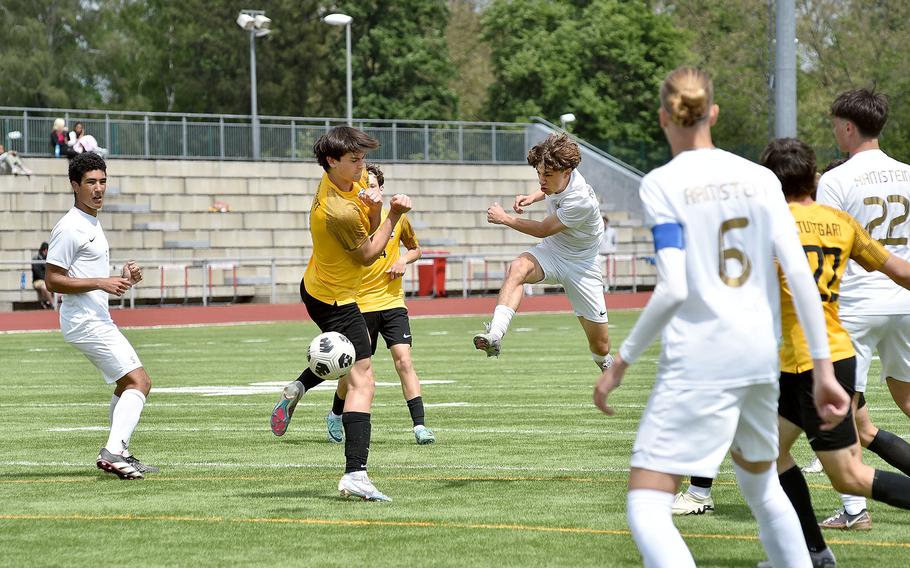 Ramstein left winger Keiran Goodall shoots around Stuttgart defender Gabe Tamez in a Division I semifinal of the DODEA European soccer championships May 22, 2024, at Kaiserslautern High School in Kaiserslautern, Germany.