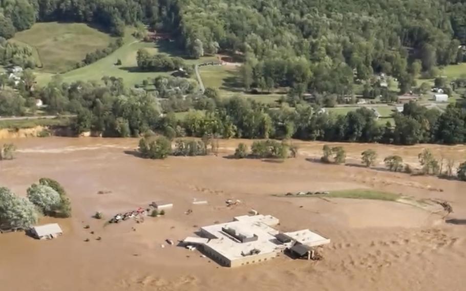 A helicopter on the roof of Unicoi County Hospital in Erwin, Tenn., where patients and staff had to be rescued from after the Nolichucky River flooded