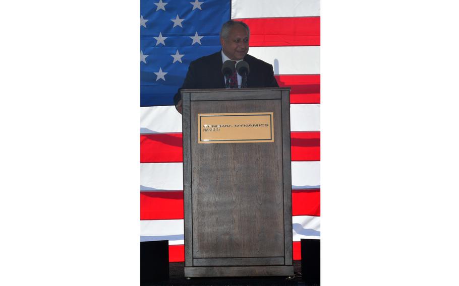 Carlos Del Torro addresses attendees during the christening ceremony