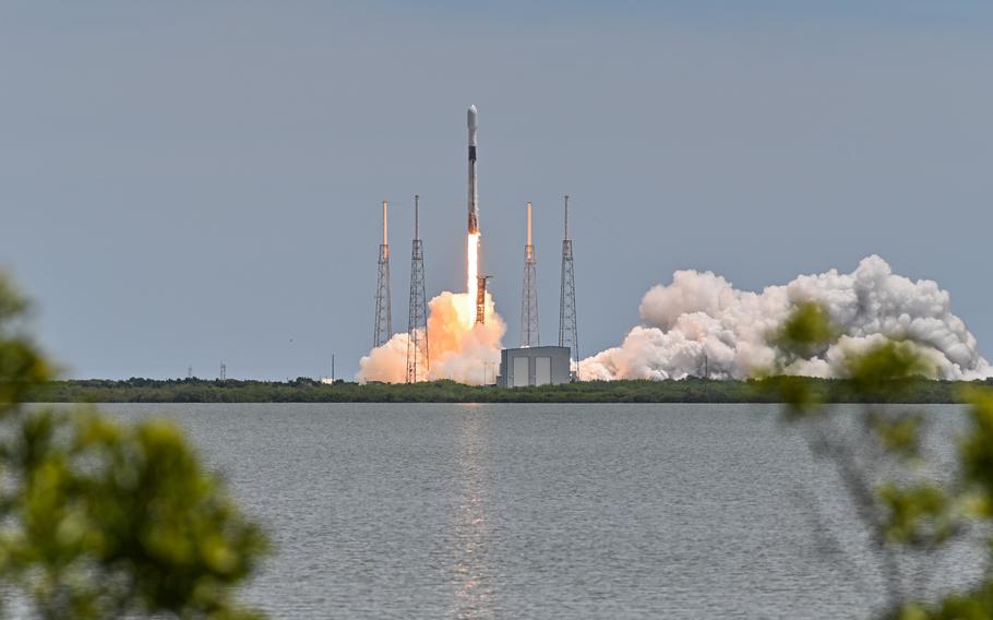 A Falcon 9 rocket carrying a GPS satellite lifts off from Cape Canaveral Space Force Station in Florida.