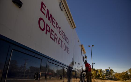 A U.S. Army Corps of Engineers Temporary Emergency Power Team sets up communication cables in Hendersonville, N.C.