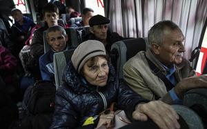 https://www.stripes.com/incoming/dfqi9h-ukrainian-evacuees-ap/alternates/LANDSCAPE_300/Ukrainian%20evacuees%20AP%20