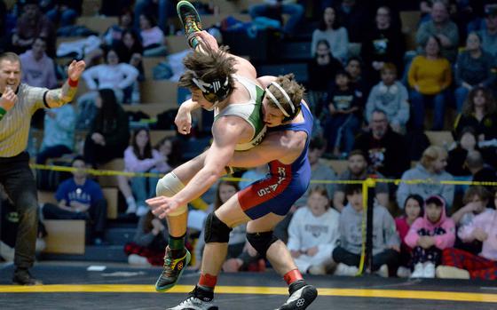 Ramstein’s Kydan Echard pulls down Samual Pounds on his way to winning the 150-pound title at the DODEA-Europe wrestling finals in Wiesbaden, Germany, Feb. 10, 2024.