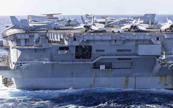 Exterior damage to USS Harry S. Truman is viewed from an MH-60S Sea Hawk helicopter Feb. 13, 2025, a day after the carrier's collision with the merchant vessel Besiktas-M near Port Said, Egypt. The ship is now at U.S. Naval Support Activity Souda Bay in Crete for repairs.