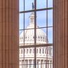 The U.S. Capitol seen through a window of the Cannon House Office Building.