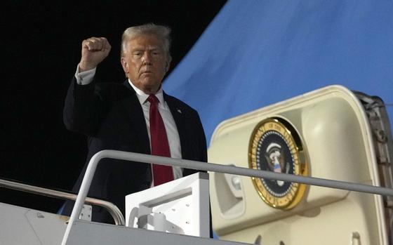 President Donald Trump boards Air Force One.