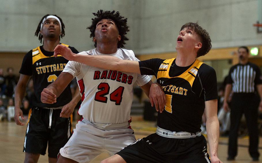 Rueben Todman and Ben Osman fight for position.