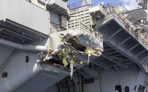 250213-N-AJ005-1044 MEDITERRANEAN SEA (Feb. 13, 2025) Exterior damage of USS Harry S. Truman (CVN 75) viewed from a ship’s rigid-hull inflatable boat following a collision with merchant vessel Besiktas-M, Feb. 12, while operating in the vicinity of Port Said, Egypt. USS Harry S. Truman, the flagship of the Harry S. Truman Carrier Strike Group (HSTCSG), is on a scheduled deployment in the U.S. 6th Fleet area of operations supporting U.S. Naval Forces Europe-Africa to defend U.S., Allied and partner interests. (U.S. Navy photo by Mass Communication Specialist 1st Class Cody Beam)