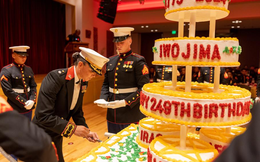 A commemorative cake for the U.S. Marine Corps’ 249th birthday being cut during a service ball at Camp Hansen in Okinawa, Japan, Oct. 24, 2024.