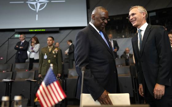 United States Secretary of Defense Lloyd Austin, center, speaks with NATO Secretary General Jens Stoltenberg during a meeting of the North Atlantic Council in NATO defense ministers format at NATO headquarters in Brussels, Friday, June 14, 2024. (AP Photo/Virginia Mayo)