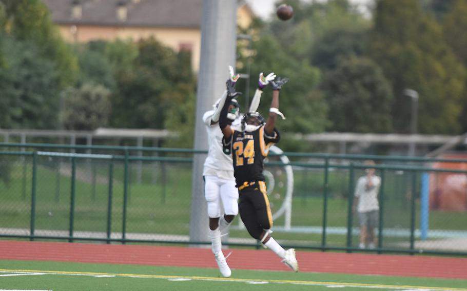 Vicenza’s Davon Gann and Naples’ Gab-riel Doran go up to try to catch a pass from Naples quarterback Camden Kasparek on Friday, Sept. 20, 2024. The ball eventually fell to the ground for an incomplete pass.