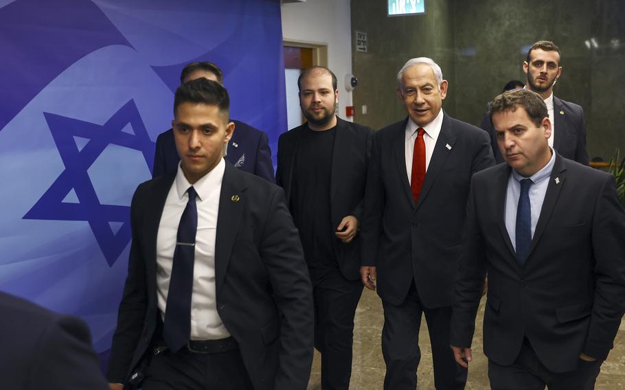 Israeli Prime Minister Benjamin Netanyahu, center right, arrives at a cabinet meeting at the prime minister’s office in Jerusalem Sunday, April 2, 2023.