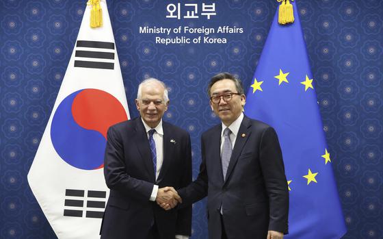 South Korean Foreign Minister Cho Tae-yul, right, shakes hands with European Union foreign policy chief Josep Borrell, at the Foreign Ministry, in Seoul, South Korea, Monday, Nov. 4, 2024. ( Chung Sung-Jun/Pool Photo via AP)