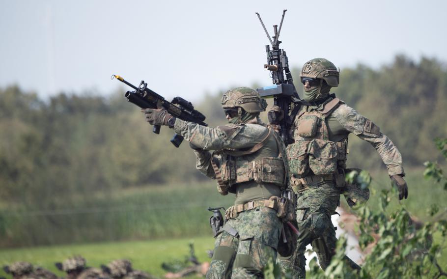 Dutch soldiers take part in an air assault demonstration 