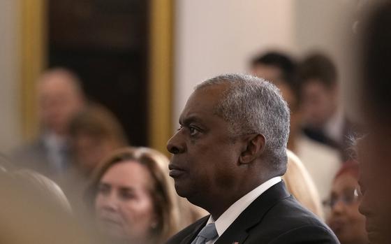 Defense Secretary Lloyd Austin listens as President Joe Biden speaks about foreign policy during a speech at the State Department in Washington, Monday, Jan. 13, 2025. (AP Photo/Susan Walsh)