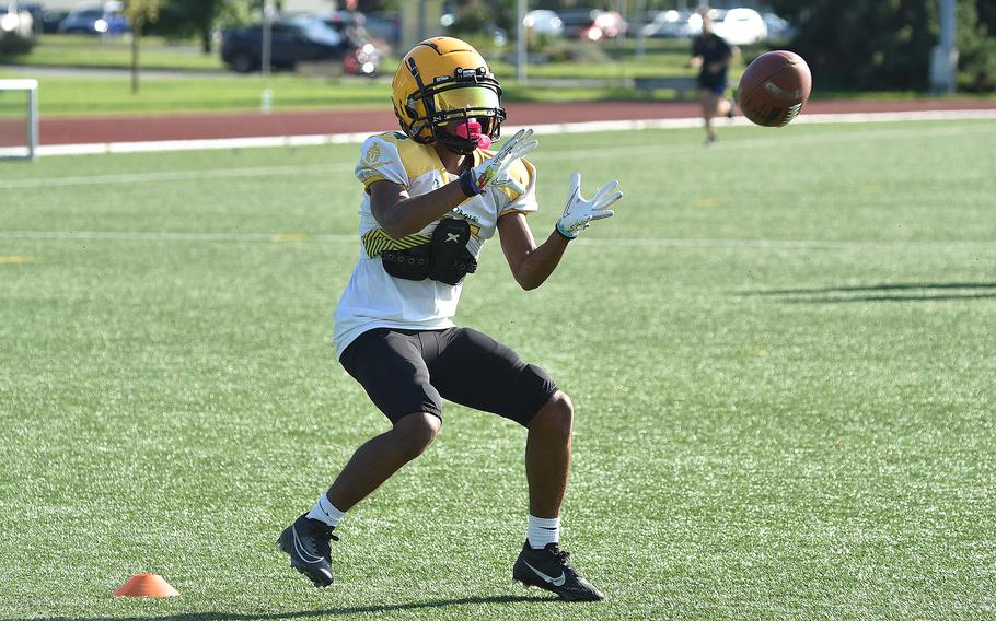 SHAPE junior Chris Carter prepares to catch a pass during a route-running drill at an Aug. 27, 2024, practice in Mons, Belgium.