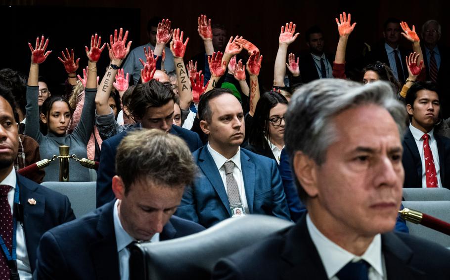 As Secretary of State Antony Blinken testifies before a Senate committee, activists protest the war in Gaza. 