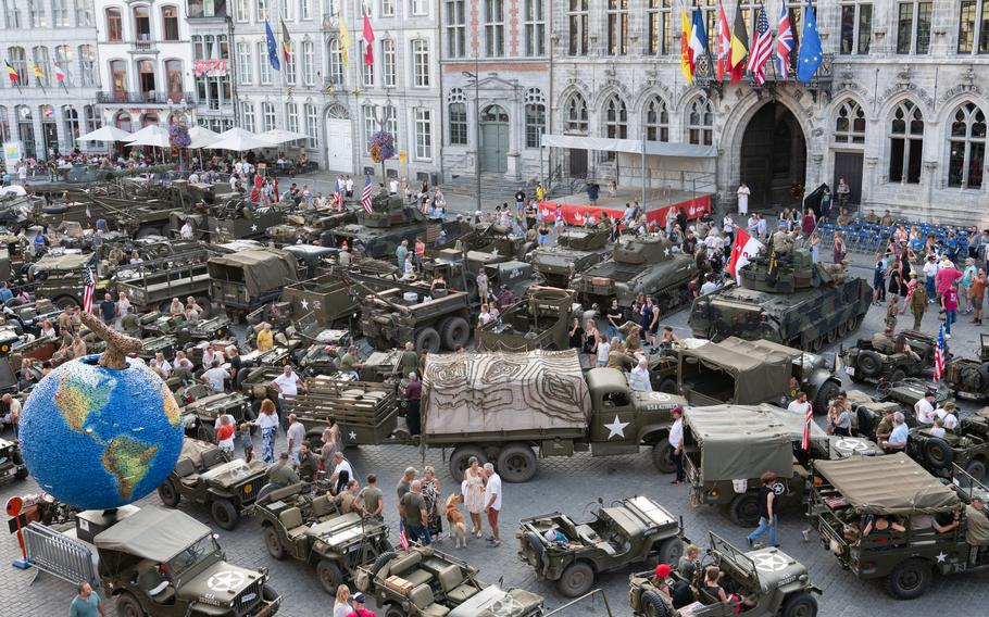 World War II military vehicles take over the Grand Place in Mons, Belgium, Sunday, Sept. 1, 2024, to mark the city’s liberation 80 years ago.  