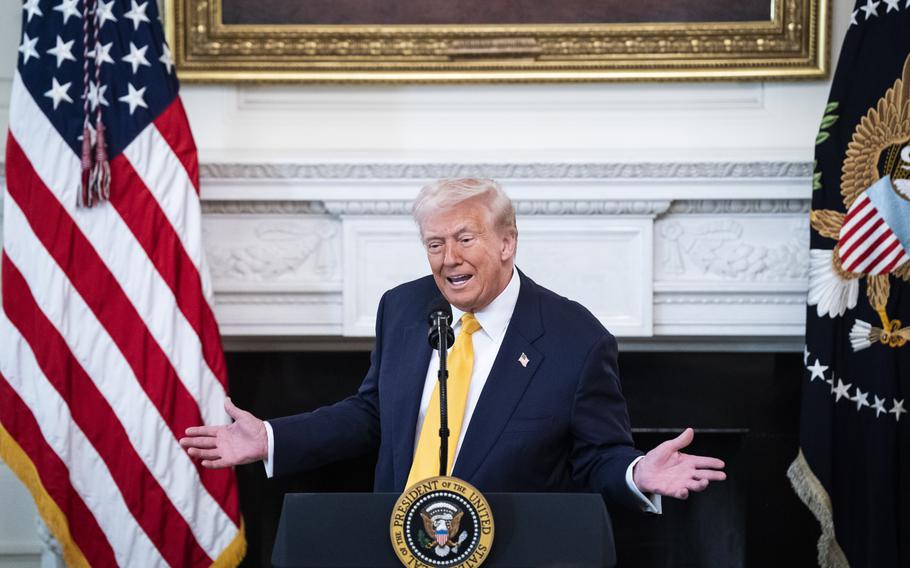 President Donald Trump speaks in the State Dining Room at the White House on Friday. 