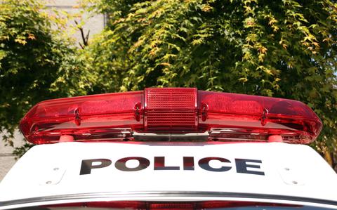 A Japanese police car is shown.