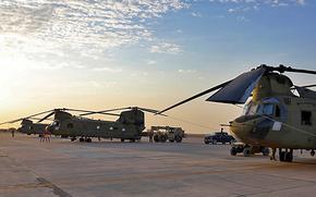 U.S. Army soldiers conduct preflight checks and load cargo onto CH-47 Chinooks Aug. 27, 2023, at al Asad Air Base, Iraq. Five U.S. service members and two American contractors were injured when two rockets struck the base Aug. 5, 2024, a defense official said on Aug. 6. 