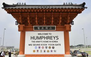 A sign shows the entrance to Camp Humphreys.