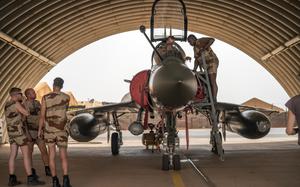 FILE - French Air Force mechanics maintain a Mirage 2000 on the Niamey, Niger base, on June 5, 2021. (AP Photo/Jerome Delay, File)