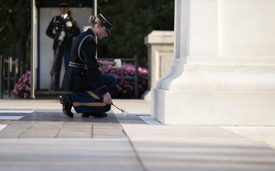 U.S. Army Spc. Jessica Kwiatkowski places a white rose at the Tomb of the Unknown Soldier, Arlington, Va., Oct. 4, 2024. 