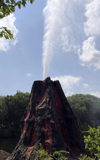 A volcano erupts on the hour at Dinosaur Place, an educational theme park in Oakdale, Conn. 