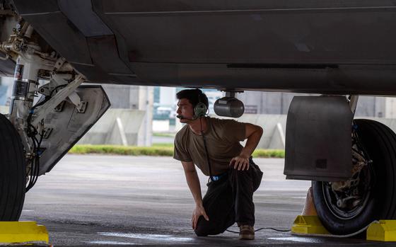 A crew chief conducts pre-flight checks on an F-22A Raptor at Kadena Air Base, Okinawa, Oct. 10, 2024. 