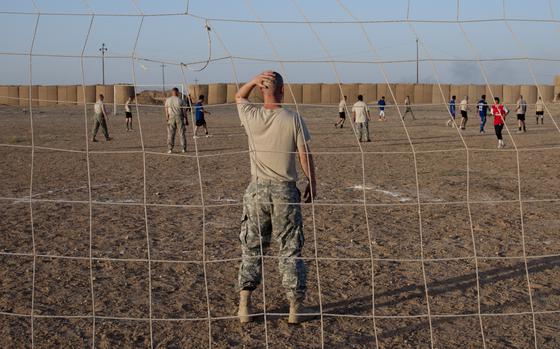 FOB Summerall, Iraq, Jul. 18, 2008: U.S. Army 1st Lt. Ben Juvinal does his best to hold back the tide during a one-sided soccer match between U.S. and Iraqi troops commemorating the American departure from Forward Operating Base Summerall near Bayji, Iraq. Despite Juvinal's efforts, the Iraqis prevailed, 7-1. 