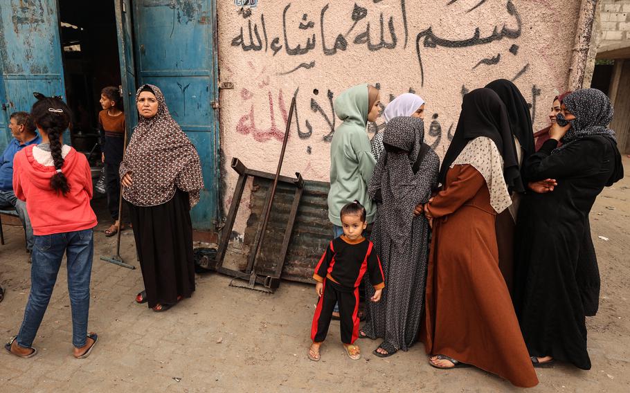 Volunteers in Rafah prepare free meals for hundreds of displaced people inside a shelter center on Nov. 12, 2023.