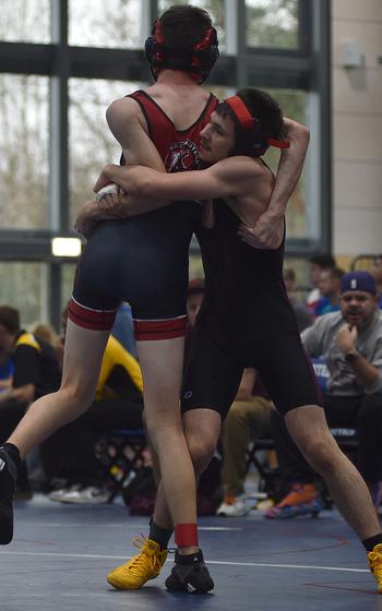 Jayden Cruz lifts Micah Miller.