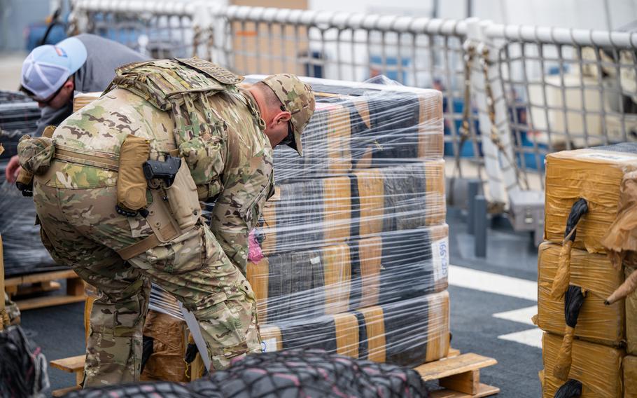 Crew members from the U.S. Coast Guard Cutter Munro (WMSL 755) offload 33,768 pounds of cocaine in San Diego, May 28, 2024. 