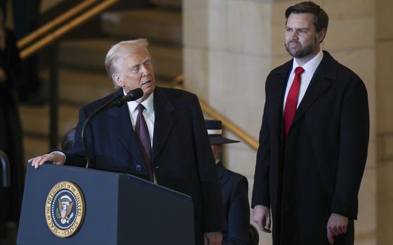 President Donald Trump speaks as Vice President JD Vance watches at Emancipation Hall after the 60th Presidential Inauguration at the U.S. Capitol in Washington, Monday, Jan. 20, 2025. (Angelina Katsanis/Pool Photo Photo via AP)