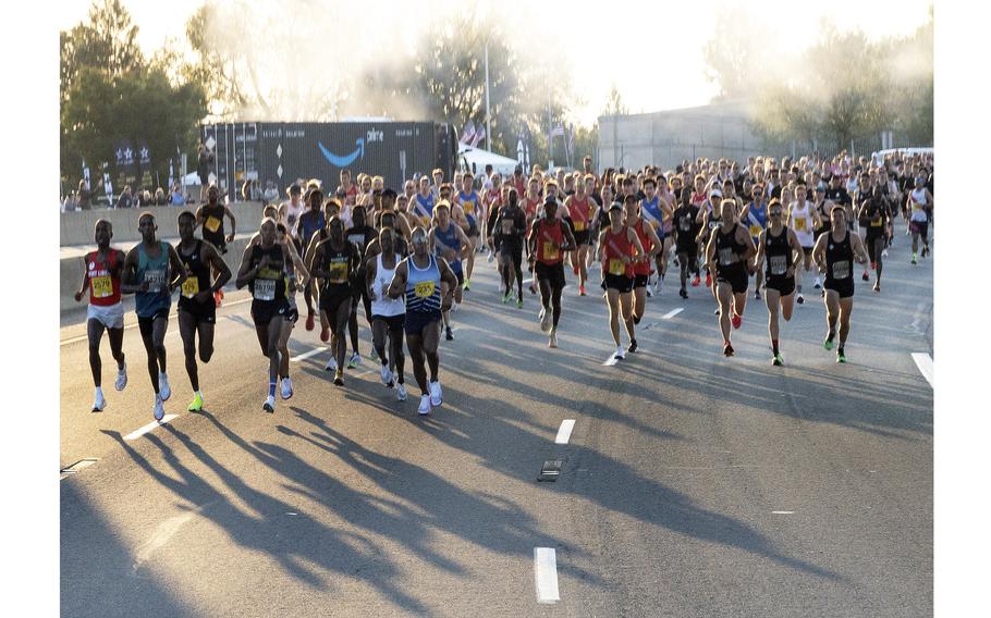 A large group of runners running on the road