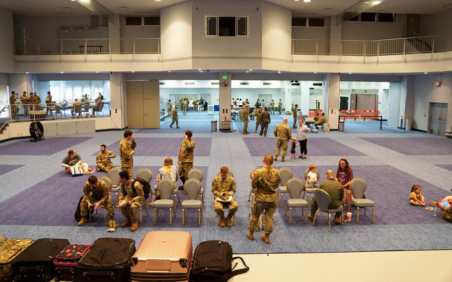 Service members and their families take part in an evacuation exercise at Yokota Air Base, Japan, Thursday, Sept. 7, 2023.