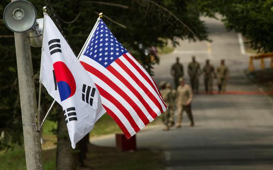 The South Korean and American flags fly next to each other at Yongin, South Korea, August 23, 2016.
